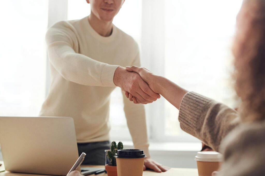 image of people shaking hands for partnership