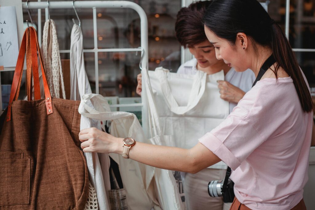 an image of people looking through clothes